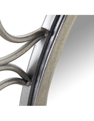 Espejo flor en metal plateado.